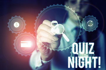 Word writing text Quiz Night. Business photo showcasing evening test knowledge competition between individuals Woman wear formal work suit presenting presentation using smart device