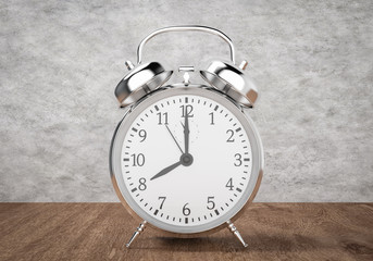 Alarm clock on wooden table and cement background, 3d rendering