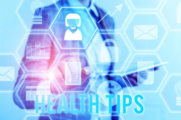 Writing note showing Health Tips. Business concept for advice or information given to be helpful in...