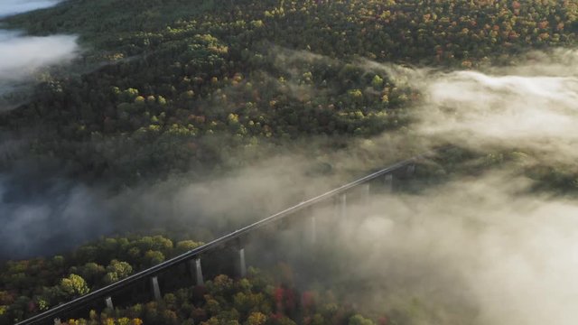 Onawa Trestle Bridge dissipating cloud at dawn Aerial 4K