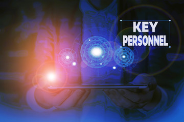 Handwriting text writing Key Personnel. Conceptual photo Program Directors Principal Investigator Project Executives Woman wear formal work suit presenting presentation using smart device