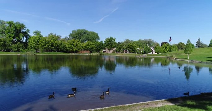 Drone Shot Flying Over The Lake At The Park