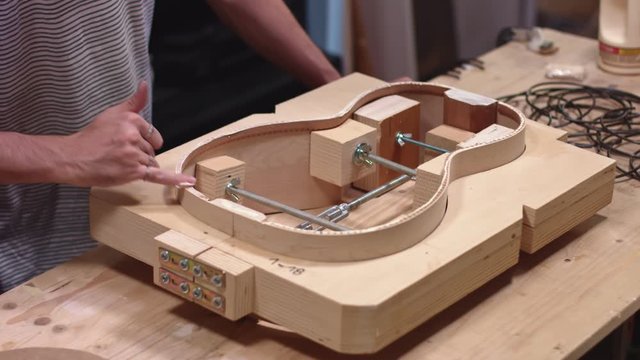 Guitar maker making a guitar from scratch