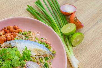 Thai cuisine delicious and spicy, Rice vermicelli spicy salad with fried Mackerel fish. Homemade or Streetfood of Thailand. 