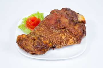 fried pork leg cooked on background