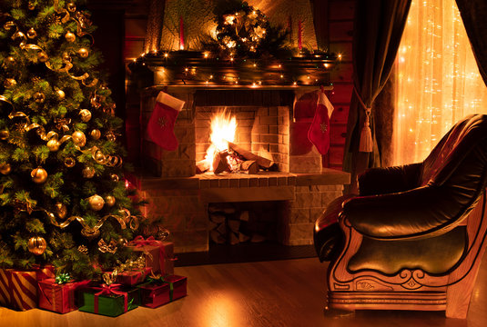 Christmas decorated interior with fireplace, armchair, window and tree