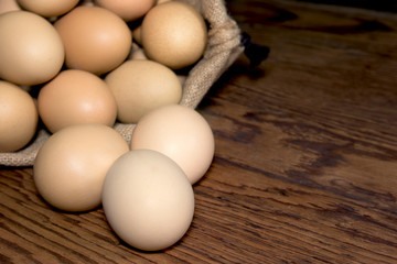 eggs in sackcloth bag on wooden table,selected focus