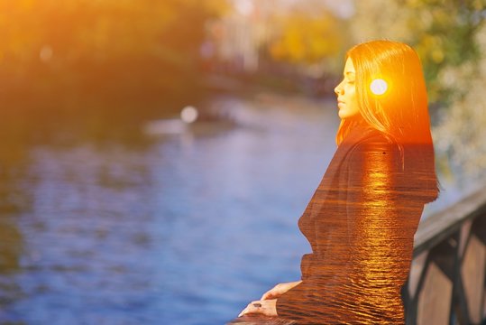 Double multiply exposure portrait of a dreamy cute woman meditating outdoors with eyes closed, combined photograph of nature, sunrise or sunset. closeup. Psychology power of mind inner voice concept.