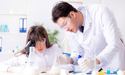 Two lab doctor testing food products