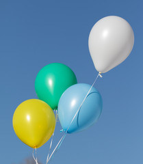 rubber balloons on a background of blue sky