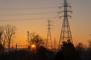 electricity pylons at sunrise
