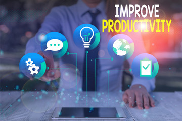 Conceptual hand writing showing Improve Productivity. Concept meaning to increase the machine and...