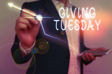 Conceptual hand writing showing Giving Tuesday. Concept meaning international day of charitable giving Hashtag activism