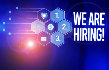 Fototapeta premium Handwriting text We Are Hiring. Conceptual photo recently you employ someone or pay someone to do particular job Male human wear formal work suit presenting presentation using smart device