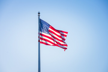 American flag on pole flowing in the wind