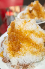 eating shaved ice with colorful dessert