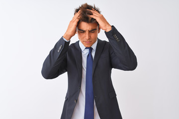 Young handsome businessman wearing suit standing over isolated white background suffering from...