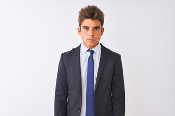 Young handsome businessman wearing suit standing over isolated white background skeptic and nervous, frowning upset because of problem. Negative person.