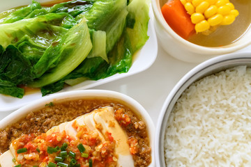 top view spicy beancurd and vegetable and maize soup and rice