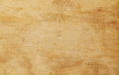 Old grunge wooden kitchen cutting board as background, chopping board close up