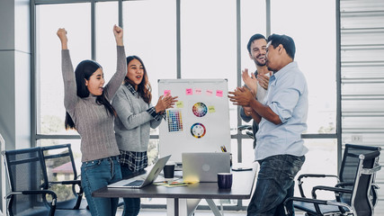 diversity creative designer applaud for job success at meeting table at modern office after finish...