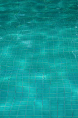 Background of rippled pattern of clean water in swimming pool 
