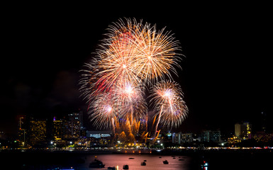 Happy new year fireworks over cityscape at night.holiday celebration festival