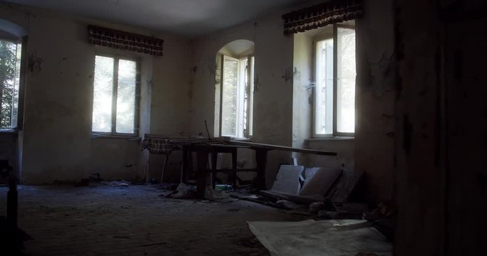Dining room of an abandoned sanatorium/hotel with a collapsed floor in South Tyrol, Italy.