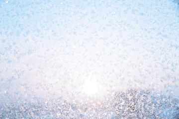 Abstract winter background with copy space. Winter texture of the frosty patterns. Soft focus and sunlight.