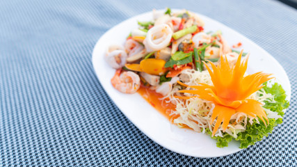 Spicy Mixed Salad on white dish, select focus.