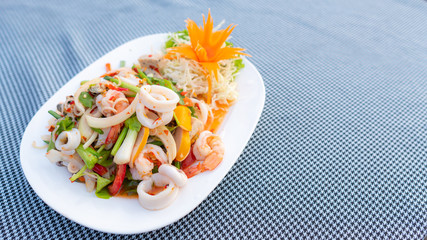 Spicy Mixed Salad on white dish, select focus.