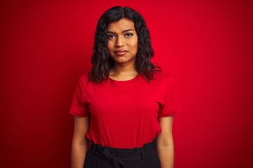 Obraz premium Beautiful transsexual transgender woman wearing t-shirt over isolated red background depressed and worry for distress, crying angry and afraid. Sad expression.