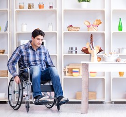 Disabled young man husband working in kitchen
