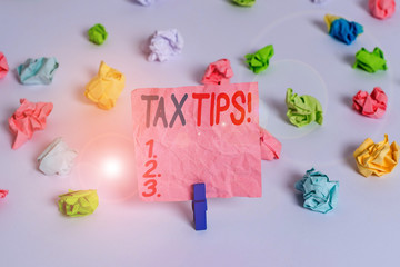 Conceptual hand writing showing Tax Tips. Concept meaning compulsory contribution to state revenue...