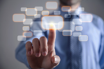 Businessman touching in virtual button. Business, Technology