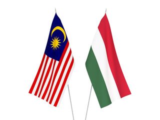 National fabric flags of Malaysia and Hungary isolated on white background. 3d rendering illustration.