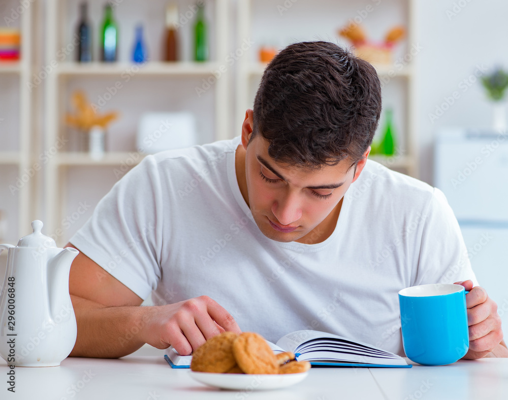 Wall mural man falling asleep during his breakfast after overtime work