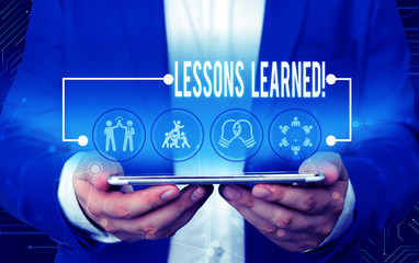 Text sign showing Lessons Learned. Business photo text experiences distilled project that should actively taken Male human wear formal work suit presenting presentation using smart device