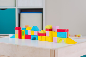 Color wooden blocks city toy building at the table