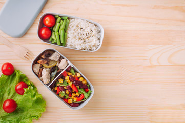 Lunch box on the wooden table with copy space