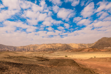 Fototapeta na wymiar Amazing View to the Red Rocks and Desert Sands in Timna National Park, Israel