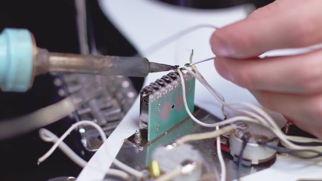 Soldering electric element of a guitar