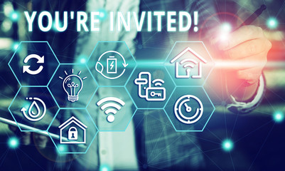 Word writing text You Re Invited. Business photo showcasing make a polite friendly request to someone go somewhere Female human wear formal work suit presenting presentation use smart device