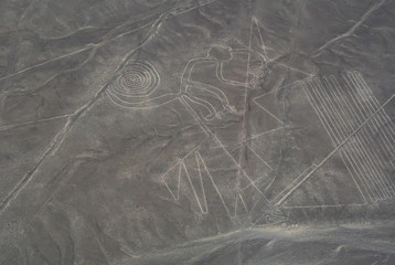 Aerial view of a monkey geoglyph. Nazca or Nasca mysterious lines, landmark in Peru