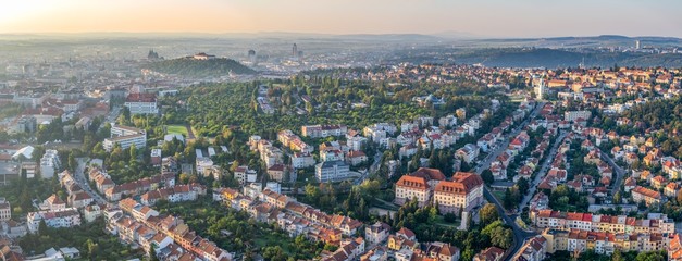 Wide angle aerial panorama of the city in sunrise from hot air balloon - obrazy, fototapety, plakaty