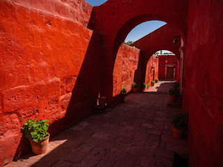 Red walls and archs in the courtyard of Saint Catherine Monastery. A monastery of nuns of the...
