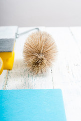 dishwashing products on white wood table