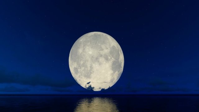 Full moon and timelapse clouds against starry sky reflecting on water surface, 4K