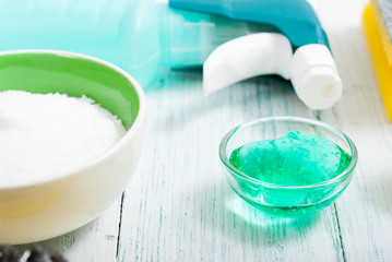 dishwashing products on white wood table