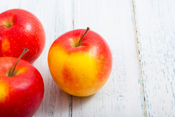 apple fruits on old white wooden table